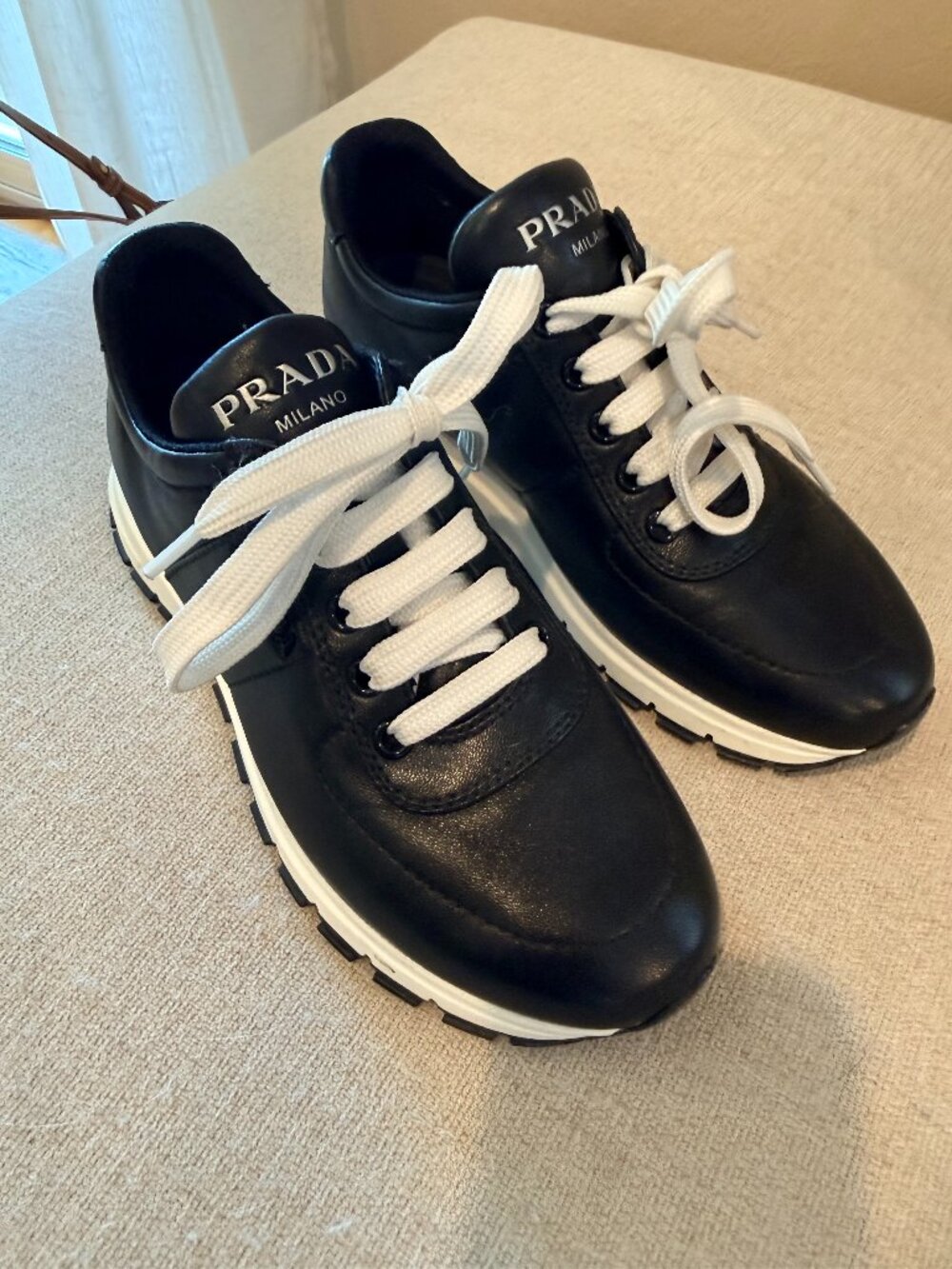 Prada leather sneakers. Black, woman's size 35. Worn once - excellent shape.